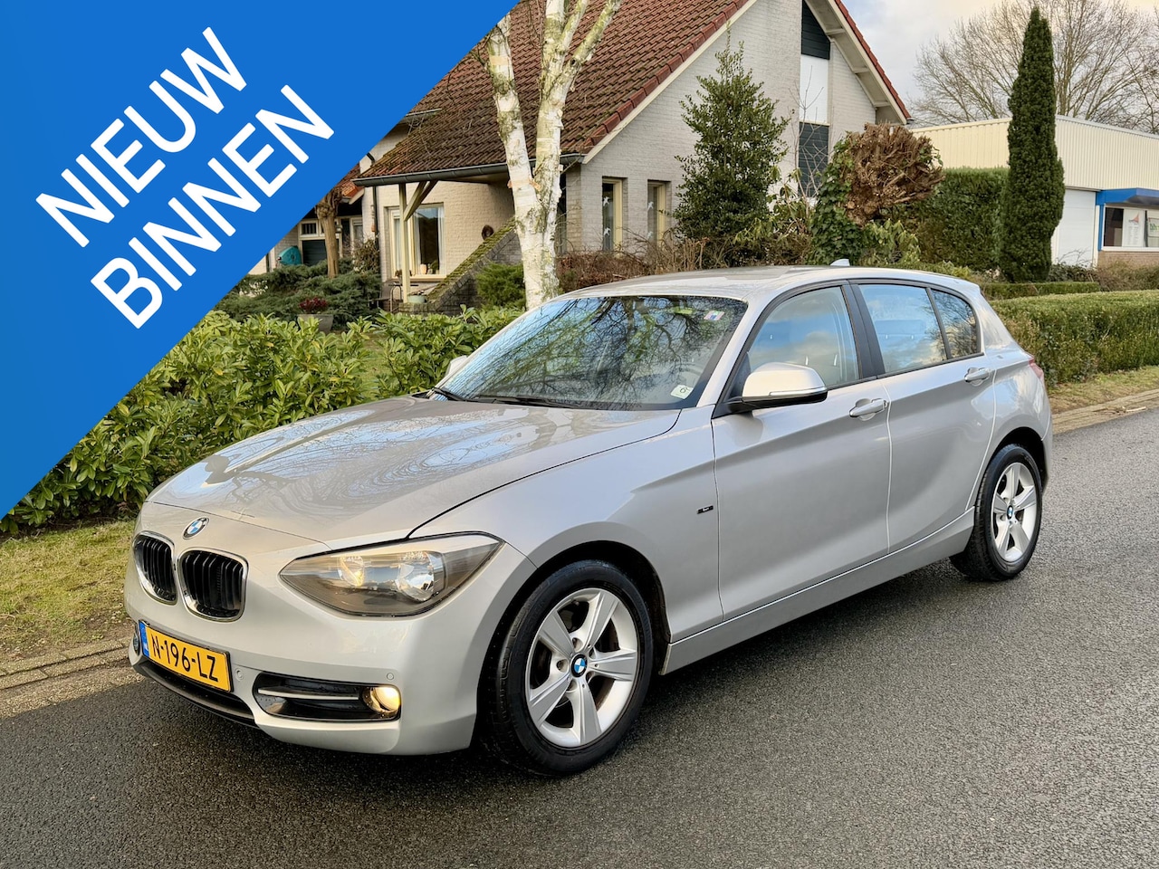 BMW 1-serie - 116i Sport 136PK Leder•Navigatie•PDC - AutoWereld.nl