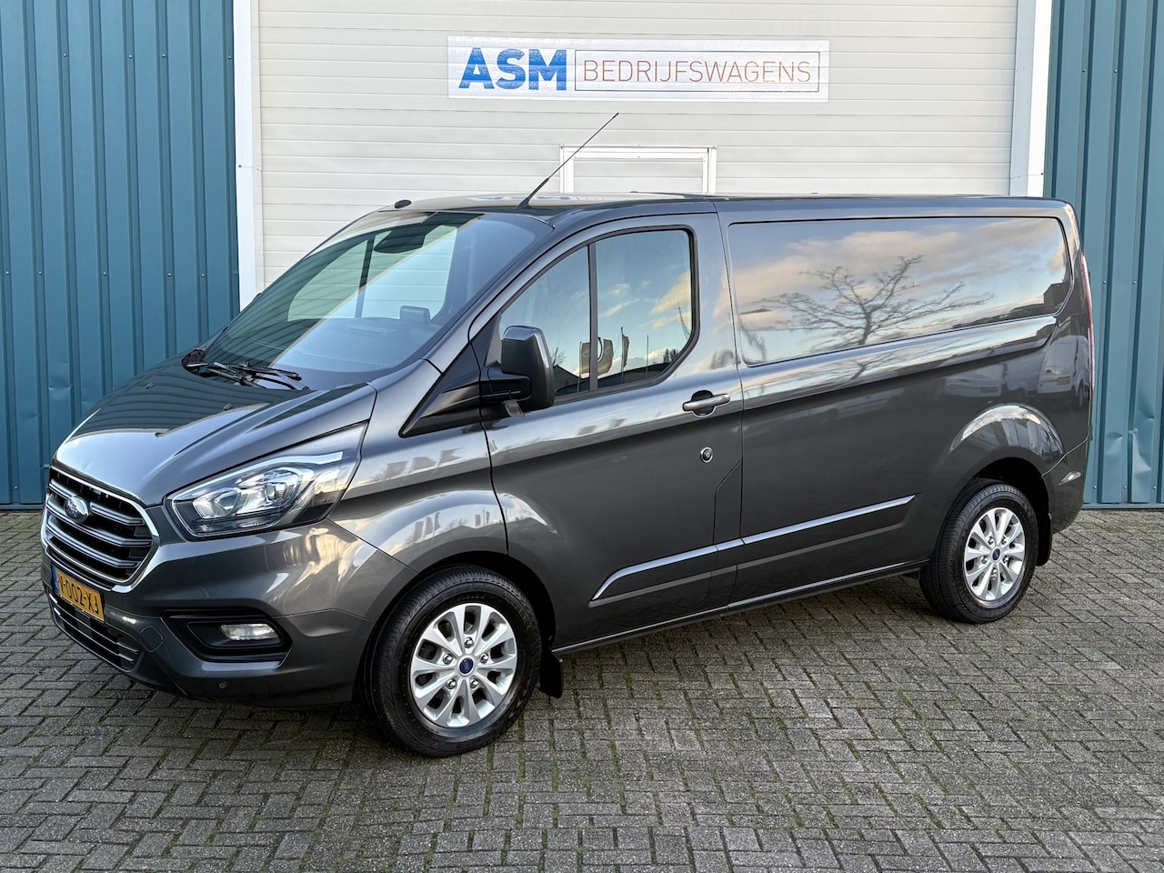 Ford Transit Custom - 280 2.0 131Pk TDCI L1H1 Limited / Cruise / Airco / Navi / Apk t/m 19-03-2025 - AutoWereld.nl