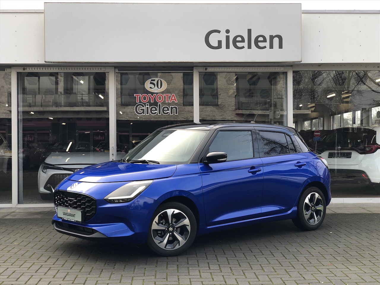 Suzuki Swift - 1.2 DualJet Hybrid Style | Dodehoekherkenning, Parkeersensoren, Stoelverwarming, Apple Car - AutoWereld.nl