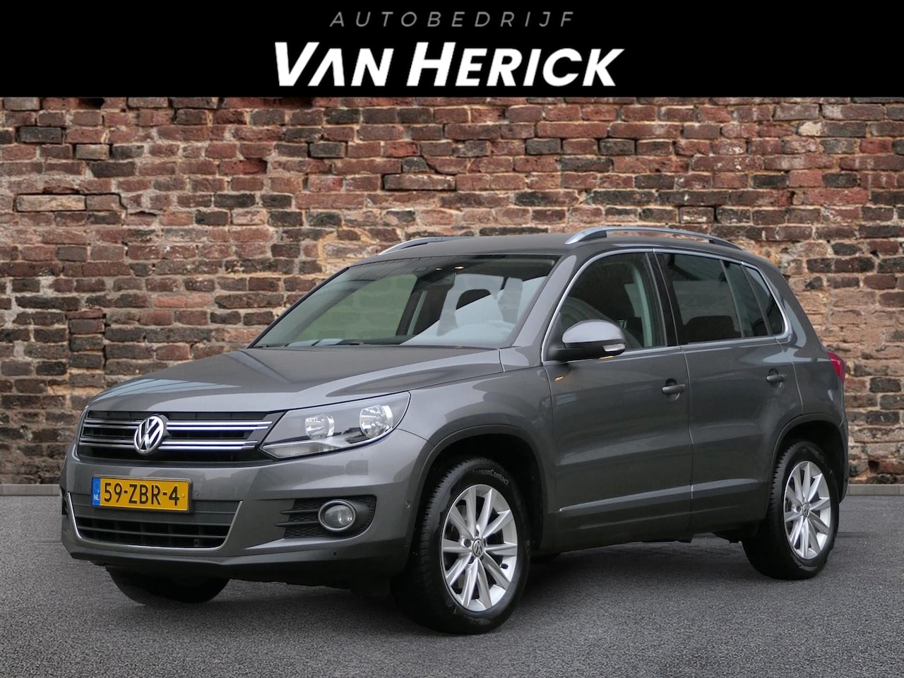 Volkswagen Tiguan - 1.4 TSI Sport&Style 122PK | Cruise | Navi | Clima - AutoWereld.nl