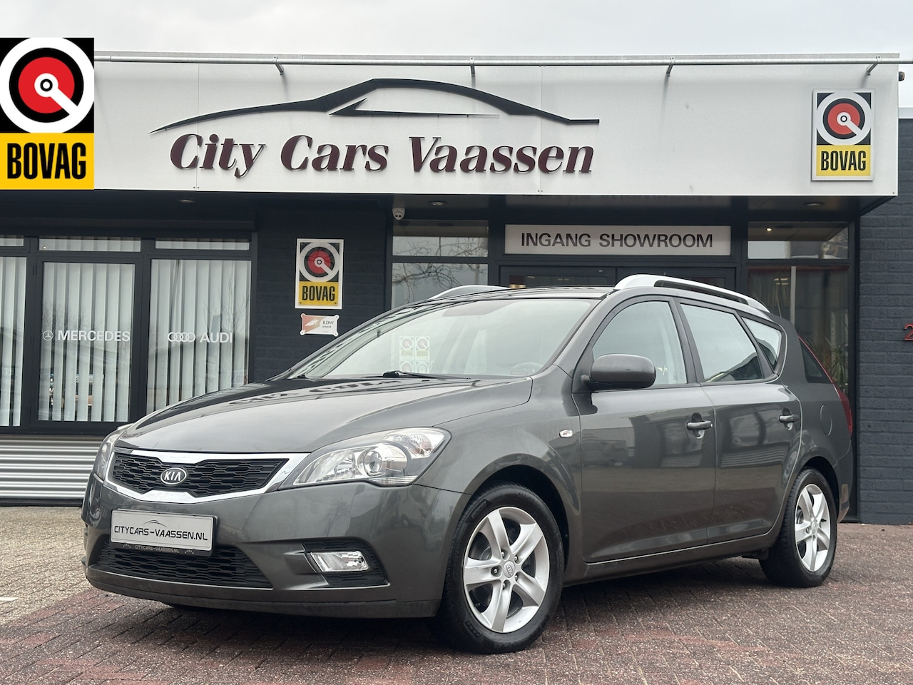 Kia Cee'd Sporty Wagon - 1.4 CVVT X-ecutive navigatie airco elktr pakket pdc achter lmv 16 inch 2e eigenaar dealer - AutoWereld.nl