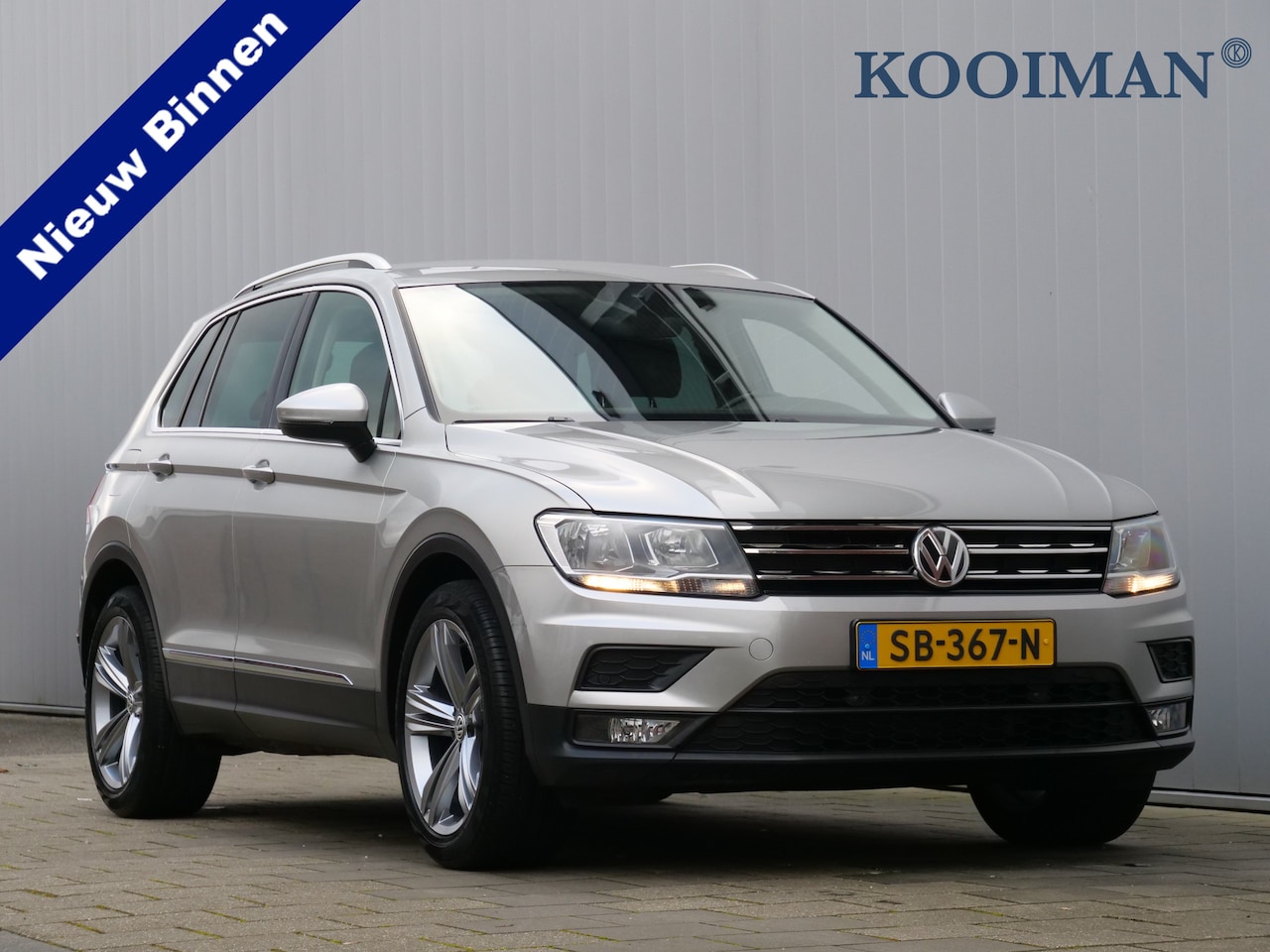 Volkswagen Tiguan - 1.4 TSI 126pk Comfortline Navigatie / DAB / 19 Inch / Camera - AutoWereld.nl