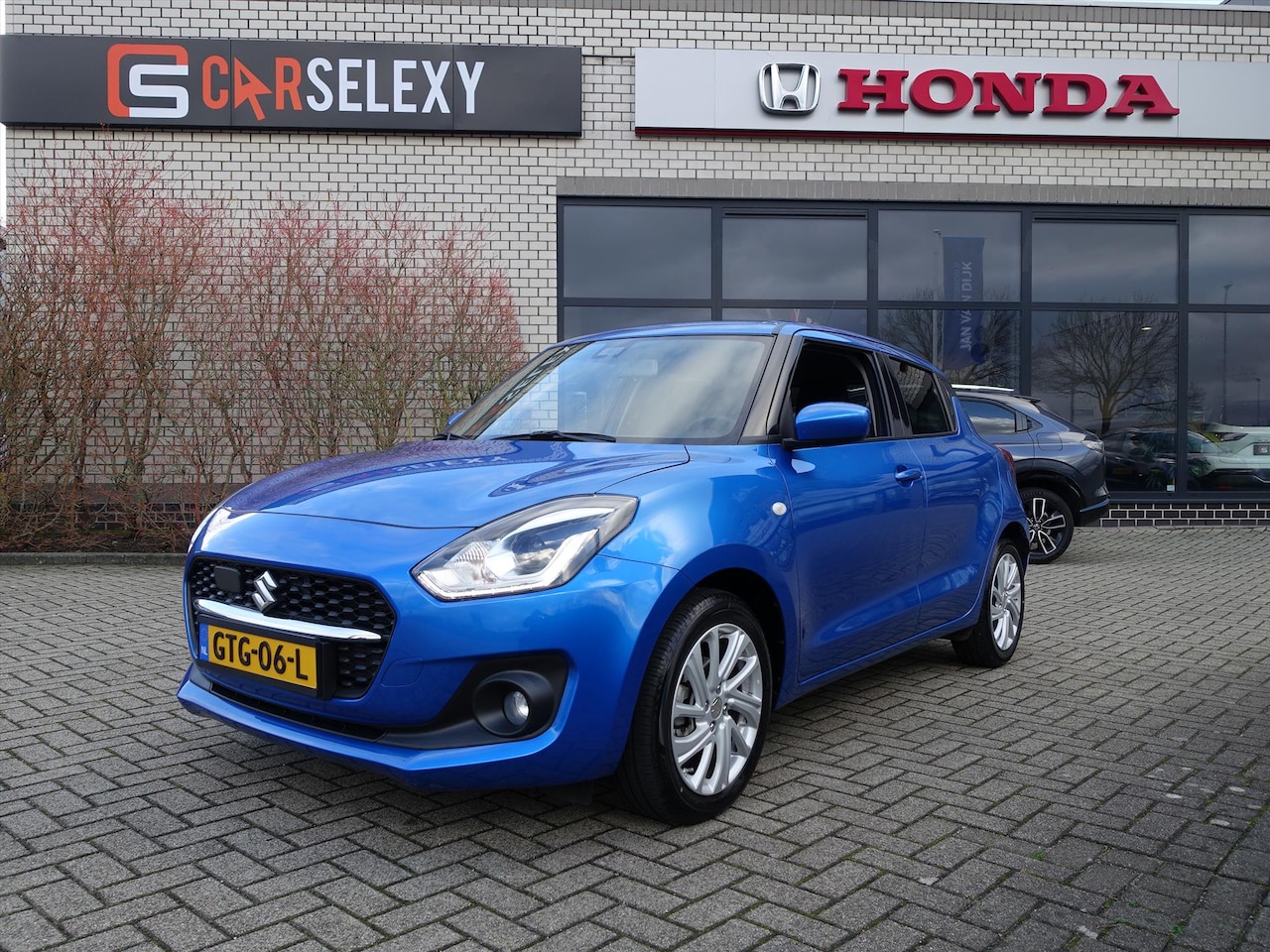 Suzuki Swift - 1.2 Select Smart Hybrid 1.2 SELECT SMART HYBRID NIEUWSTAAT - AutoWereld.nl