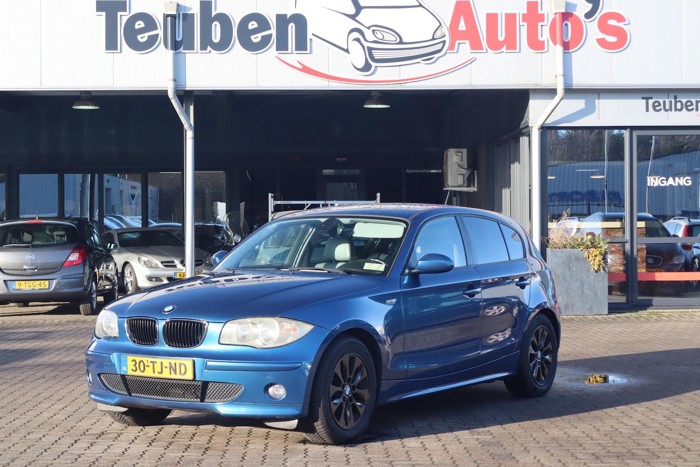 BMW 1-serie - 116i High Executive Climate control, Lederen interieur, Cruise control, - AutoWereld.nl