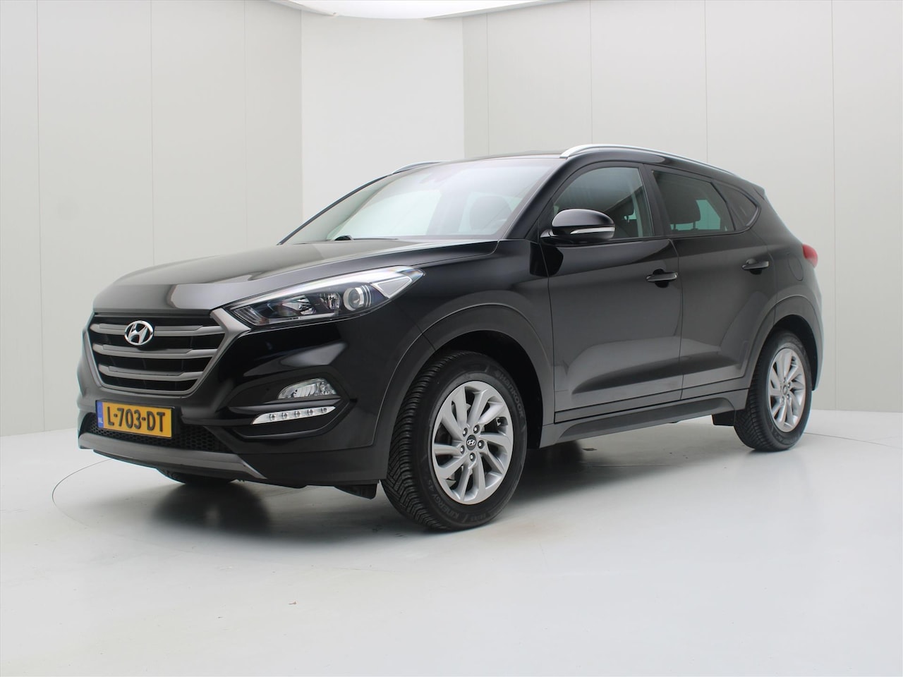 Hyundai Tucson - 1.6 T-GDi i-Motion 177pk 4WD Automaat [ TREKHAAK+CAMERA+CLIMAAT+CRUISE+PDC+NAVIGATIE ] - AutoWereld.nl