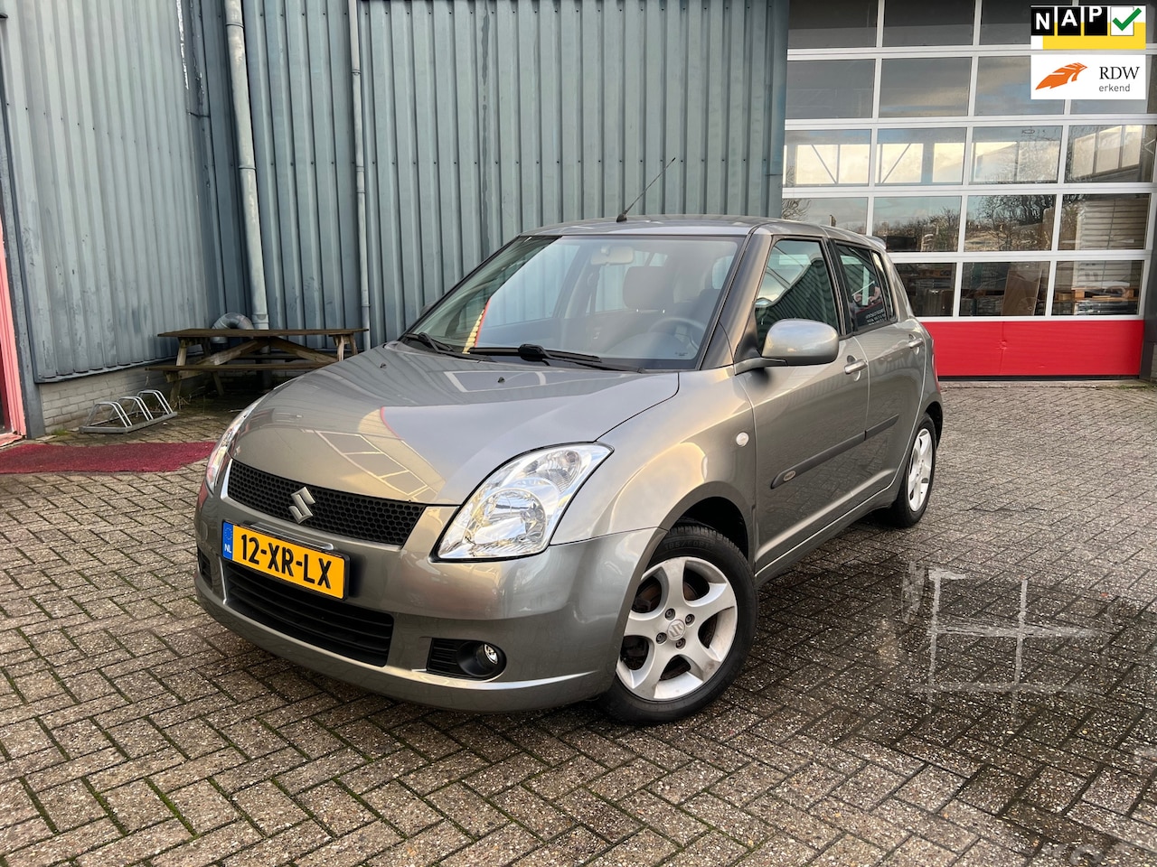 Suzuki Swift - 1.5 Exclusive Automaat / NAP / Airco / Keyless Entry - AutoWereld.nl