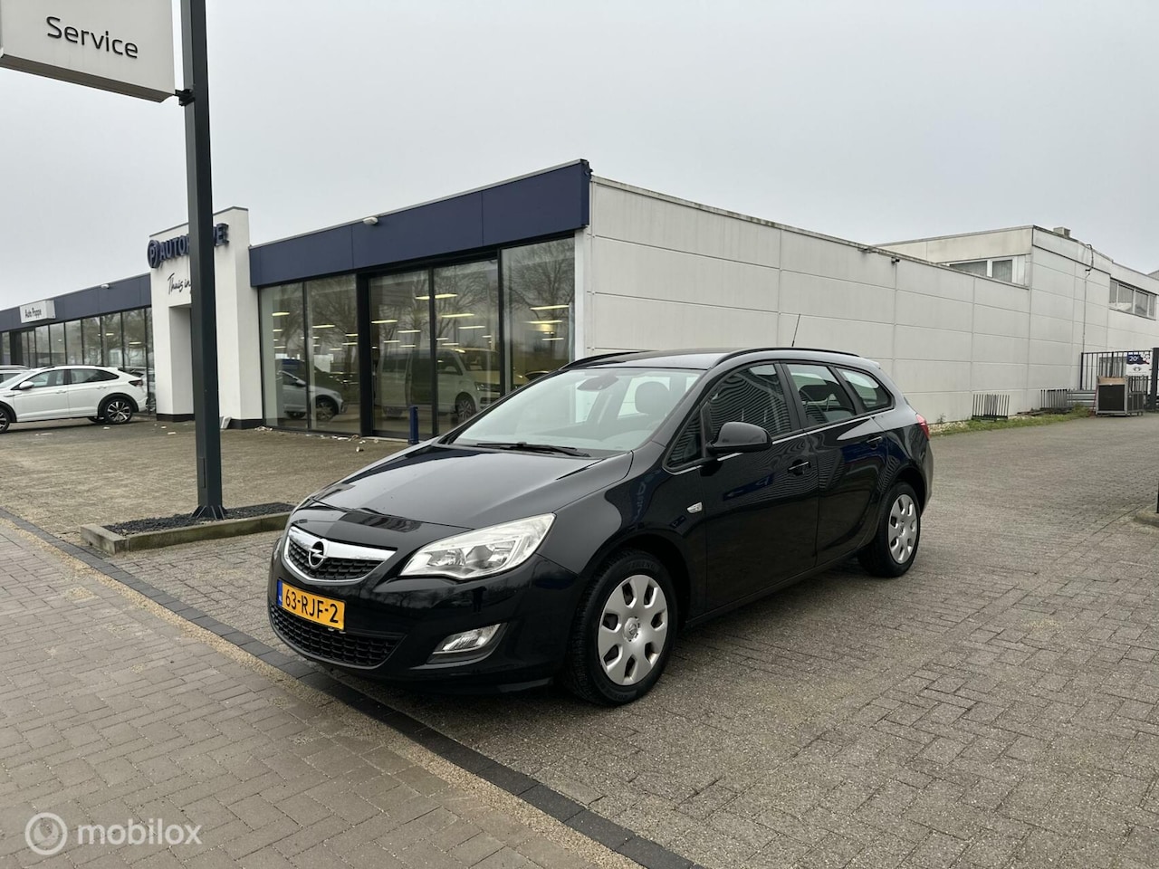 Opel Astra Sports Tourer - 1.4 Cosmo Clima Cruise NAP - AutoWereld.nl