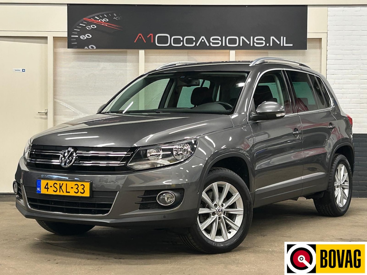 Volkswagen Tiguan - 1.4 TSI Sport&Style + NAVI - AutoWereld.nl