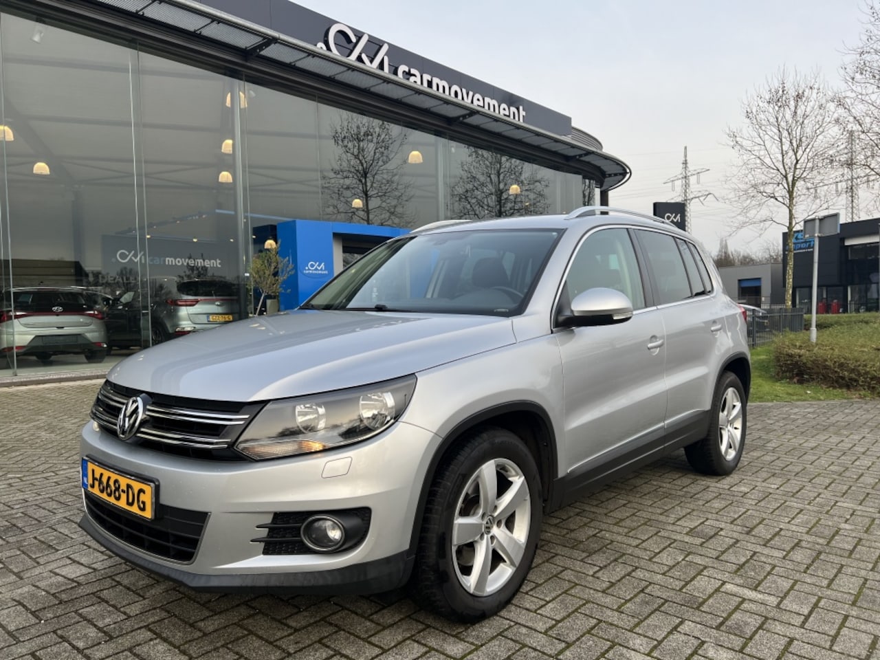 Volkswagen Tiguan - 1.4 TSI Sport&Style | Cruise | Navi | Trekhaak | Stoelverwarming - AutoWereld.nl