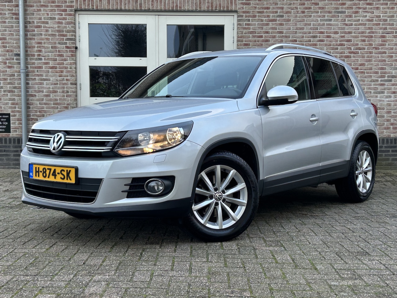 Volkswagen Tiguan - 1.4 TSI 150PK Lounge Navi Trekhaak O.H. - AutoWereld.nl