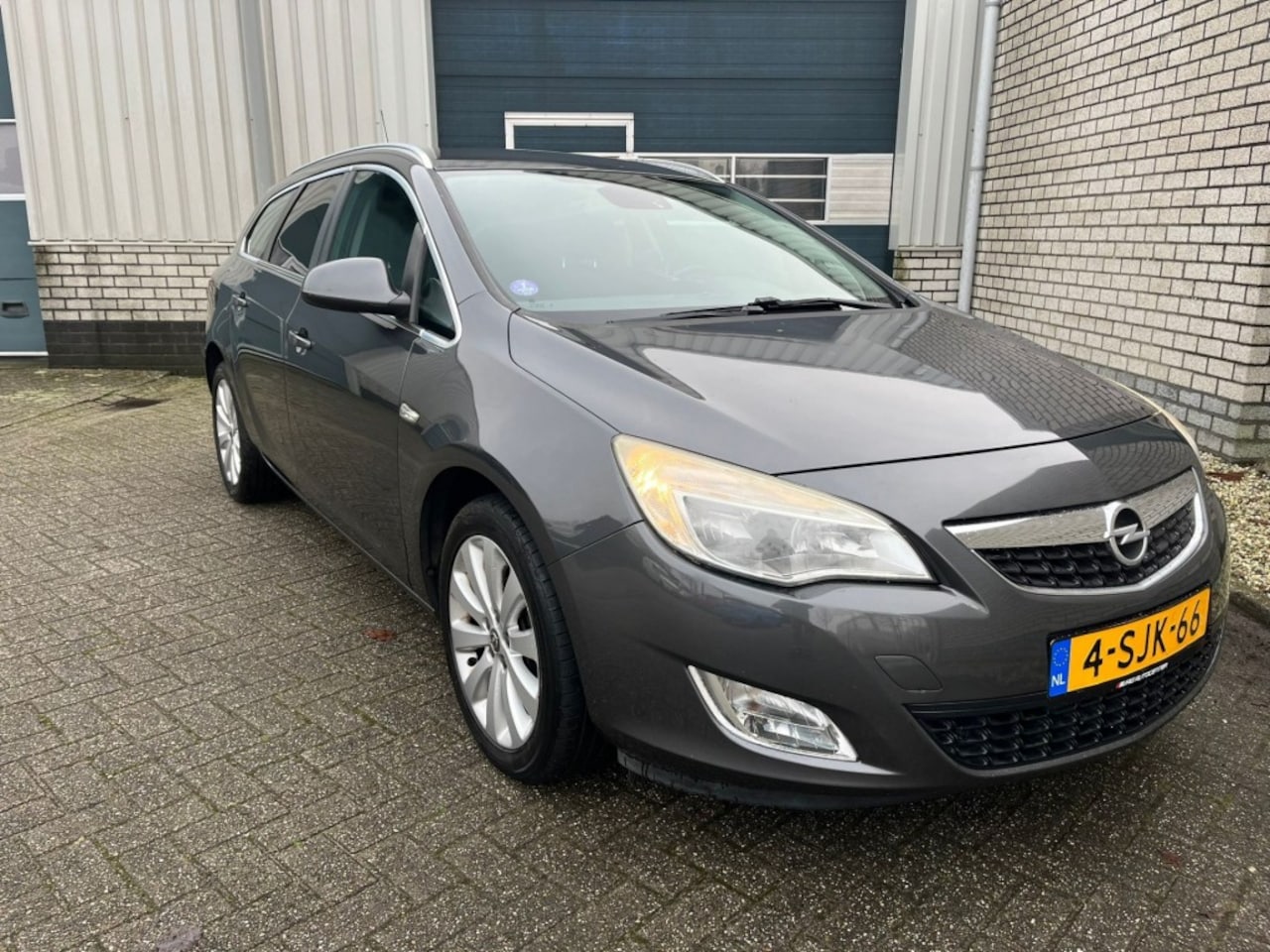 Opel Astra Sports Tourer - 1.4 Sports Tourer-Clima-Cruisecontrol-Half leder - AutoWereld.nl