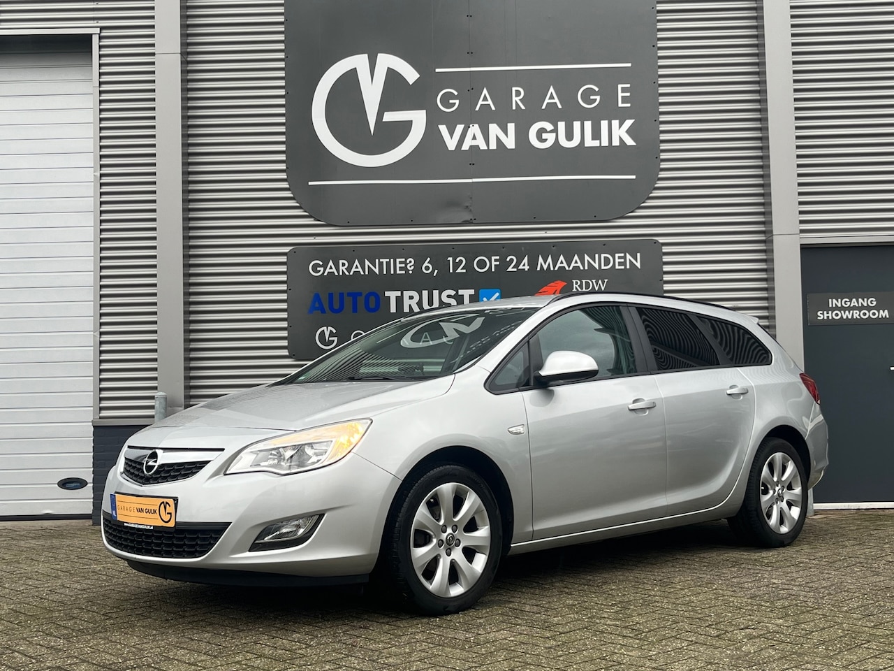 Opel Astra Sports Tourer - 1.4 120PK Turbo Airco,Cruise,Navi,Trekhaak,Isofix,Lmv,GetintGlas,Bluetooth,Mistlampen,6ver - AutoWereld.nl