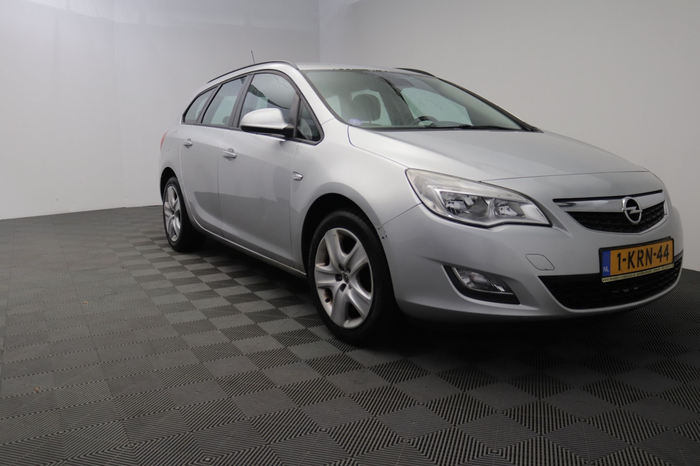 Opel Astra Sports Tourer - 1.4 Edition airco trekhaak - AutoWereld.nl