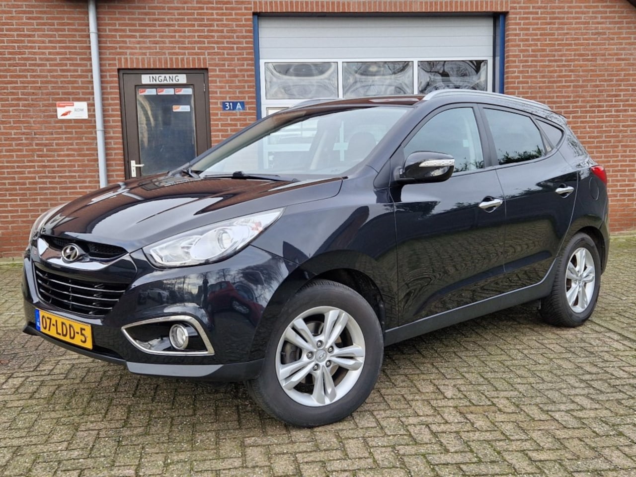 Hyundai ix35 - 2.0I Style 2WD Clima Cruise NL-auto Half leder Trekhaak - AutoWereld.nl