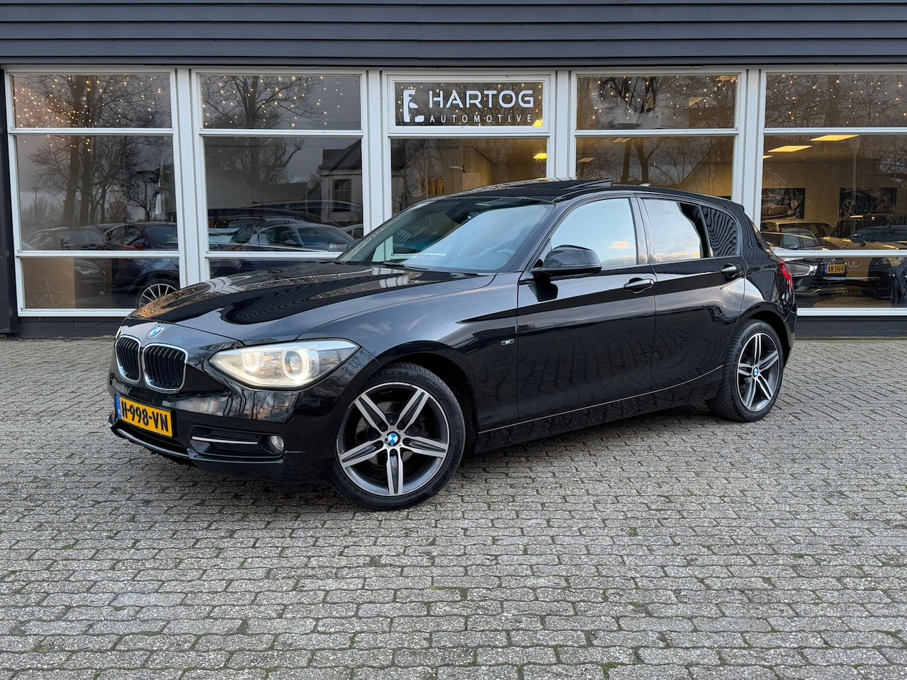 BMW 1-serie - 116i High Executive | Autm | Clima | Cruise | Navi | Dak | - AutoWereld.nl