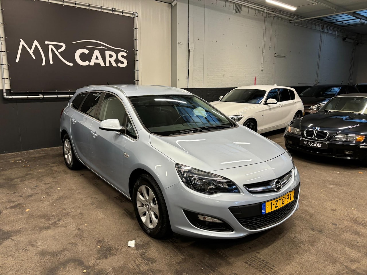 Opel Astra Sports Tourer - 1.4 Turbo Edition Airco/Cruise Control - AutoWereld.nl