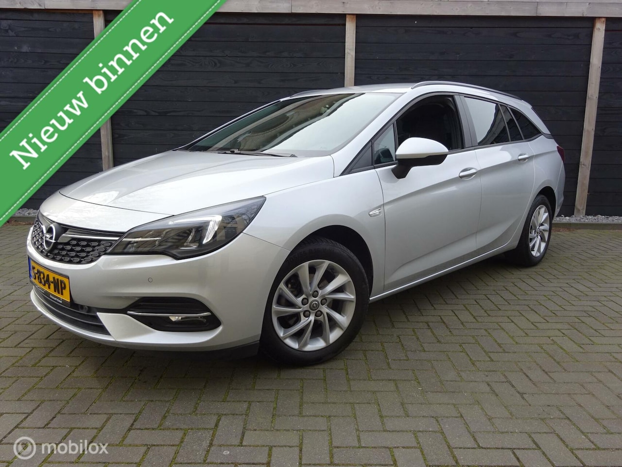 Opel Astra Sports Tourer - 1.2 145PK!!! Edition FM nav / Stoel-stuur verwarming / 36.845 KM!!! - AutoWereld.nl