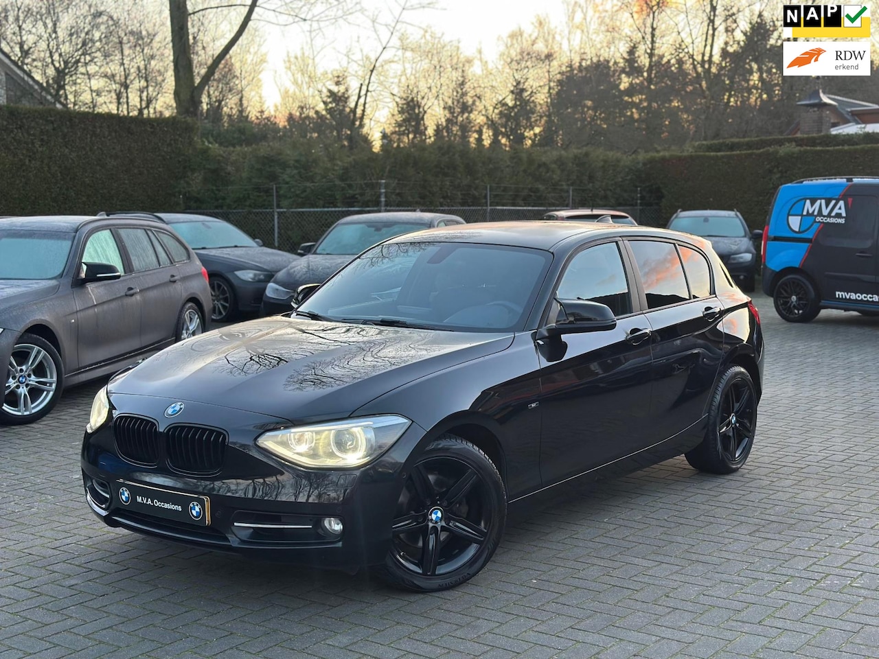 BMW 1-serie - 118i High Executive Sport|Nwe Ketting + Klepseals|Carplay|Leder|Groot Navi|Climate control - AutoWereld.nl