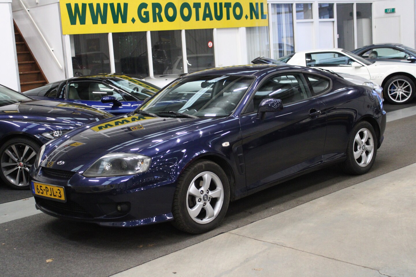 Hyundai Coupé - 1.6 Isofix, Half leder, Sportstoelen, Xenon - AutoWereld.nl