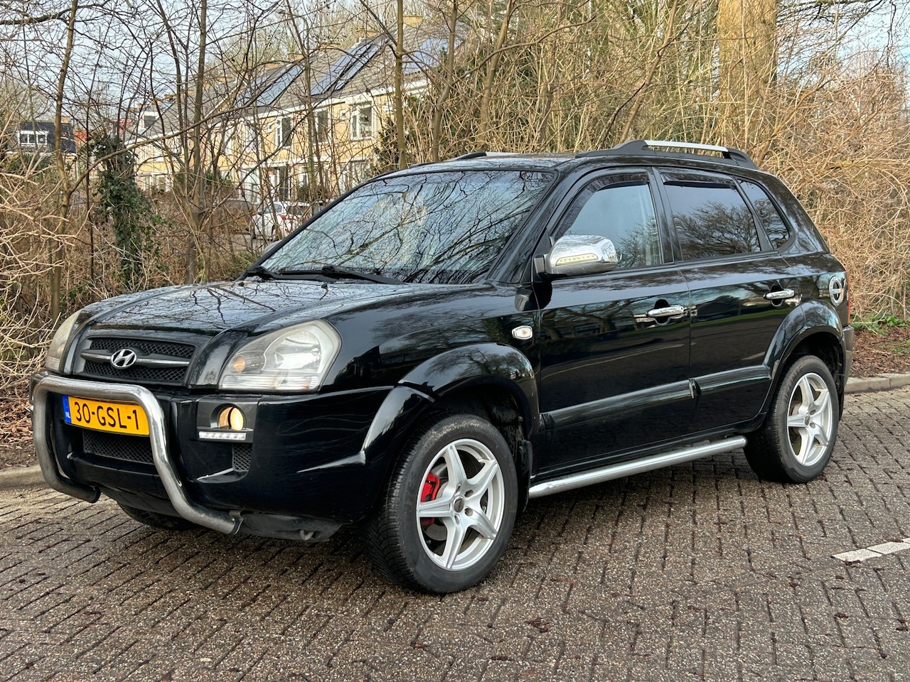 Hyundai Tucson - 2.0i Style Supreme 2008 navi! leer! trekhaak! cruise control! hoge instap! led! - AutoWereld.nl