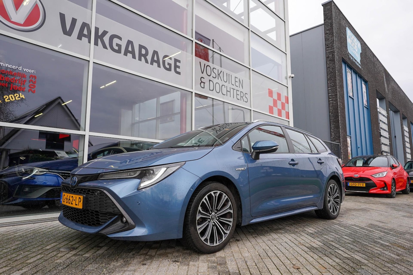 Toyota Corolla Touring Sports - 1.8 Hybrid Business Intro| Stoelverwarming | Navi | Camera - AutoWereld.nl