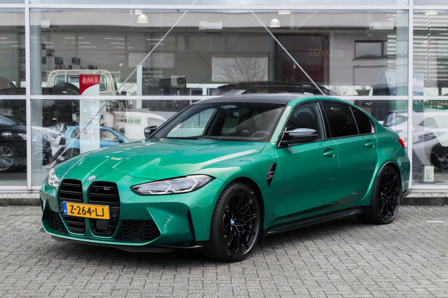 BMW M3 - 3-Serie G80 Competition xDrive 510pk | H/K | Carbon | HUD | Laser | Isle of Man Green - AutoWereld.nl