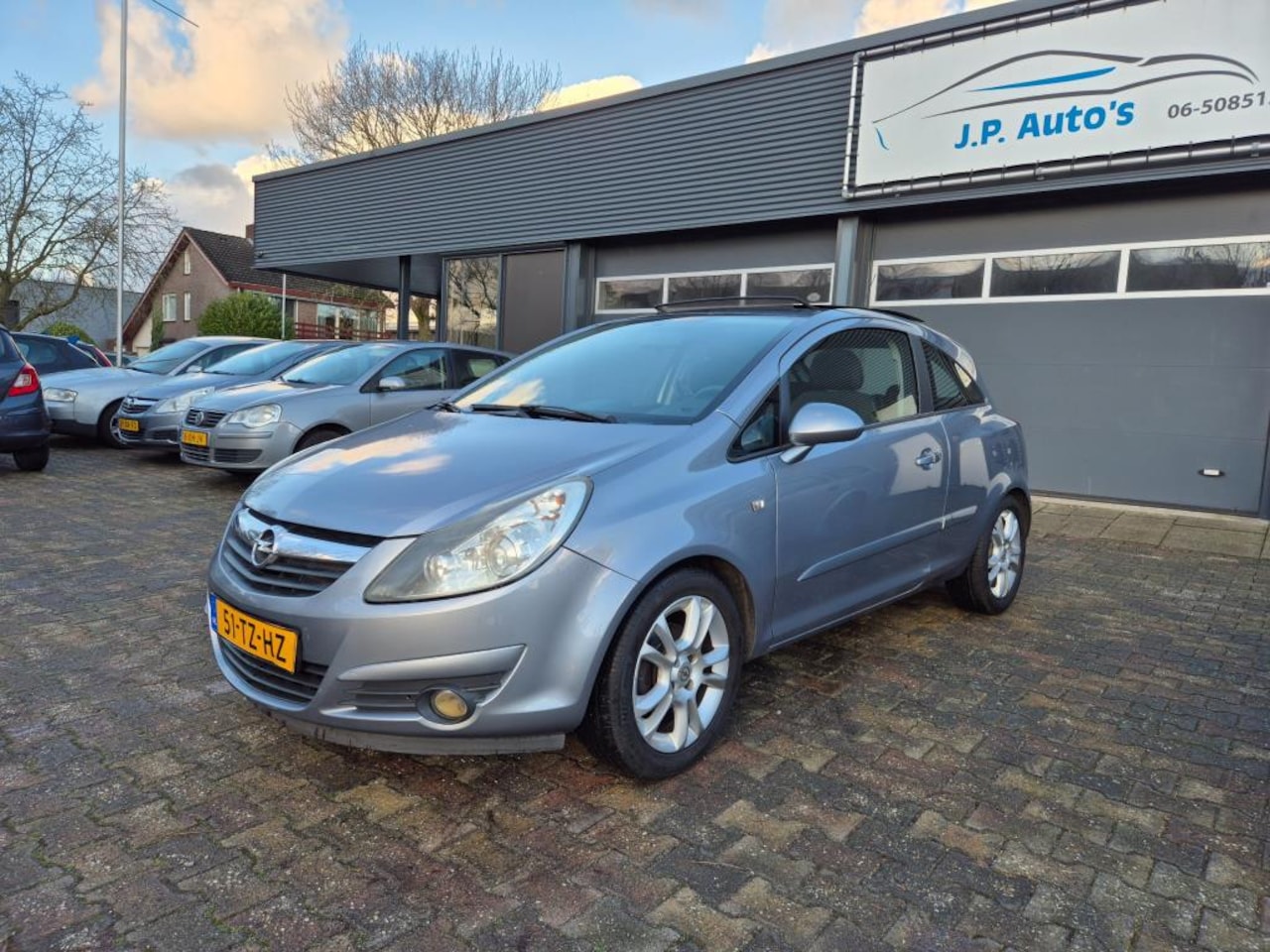 Opel Corsa - 1.4-16V Sport panoramadak - AutoWereld.nl