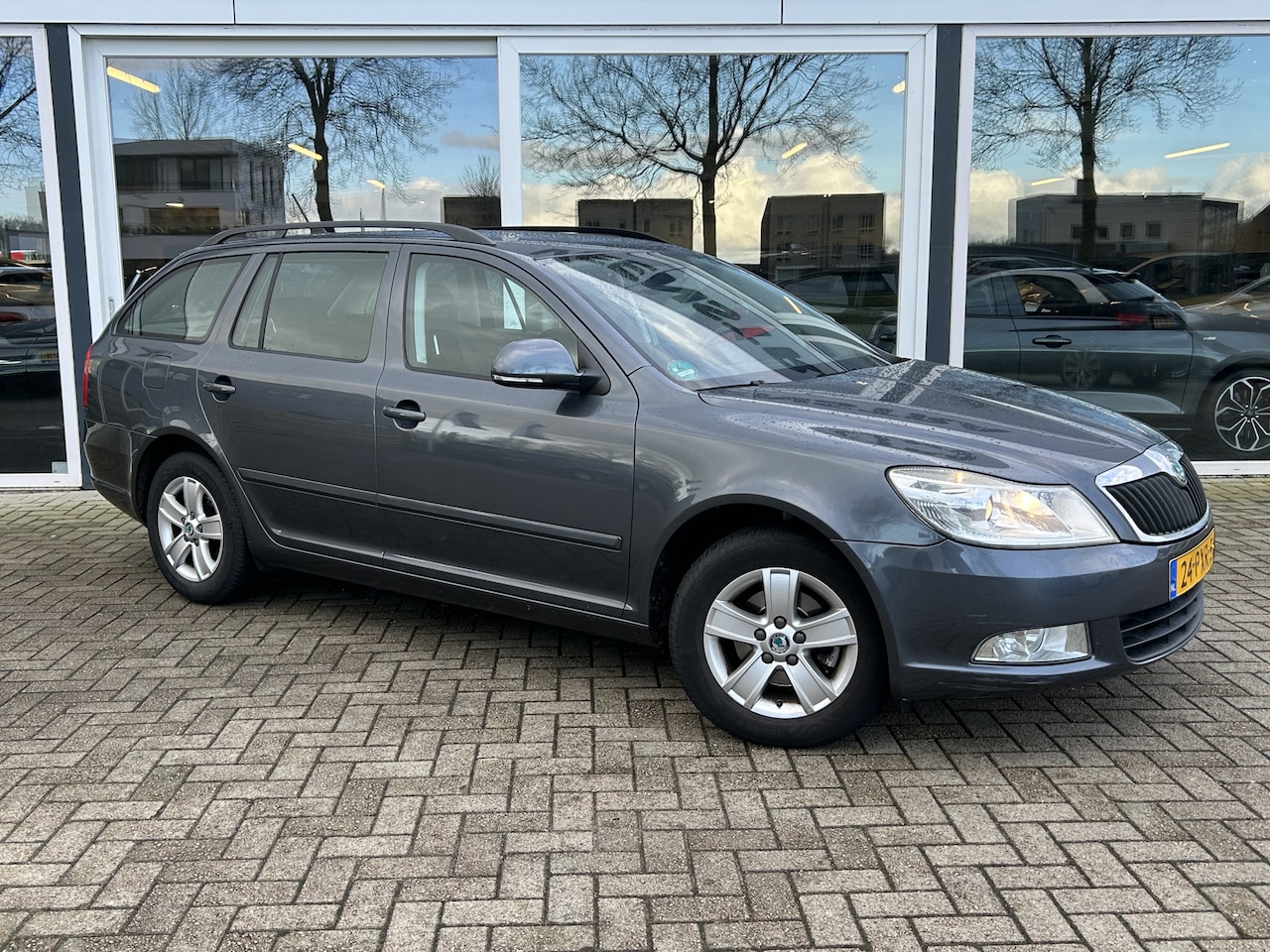 Skoda Octavia Combi - 1.2 TSI Ambition Business Line LMV / Cruise / PDC achter / Airco - AutoWereld.nl