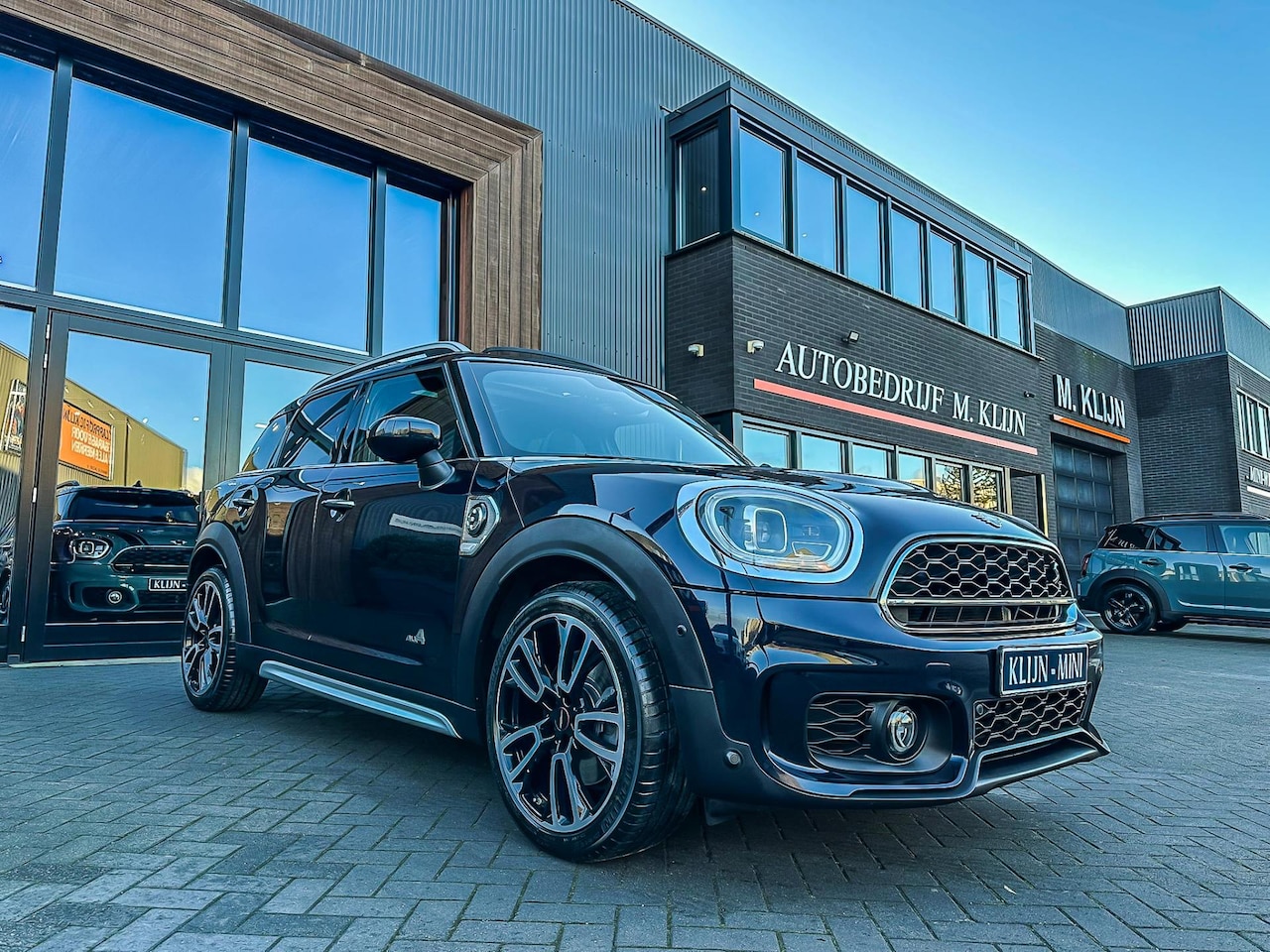 MINI Countryman - Mini 2.0 Cooper S E ALL4 John Cooper Works 220pk/pano/camera/HK/19"/btw - AutoWereld.nl