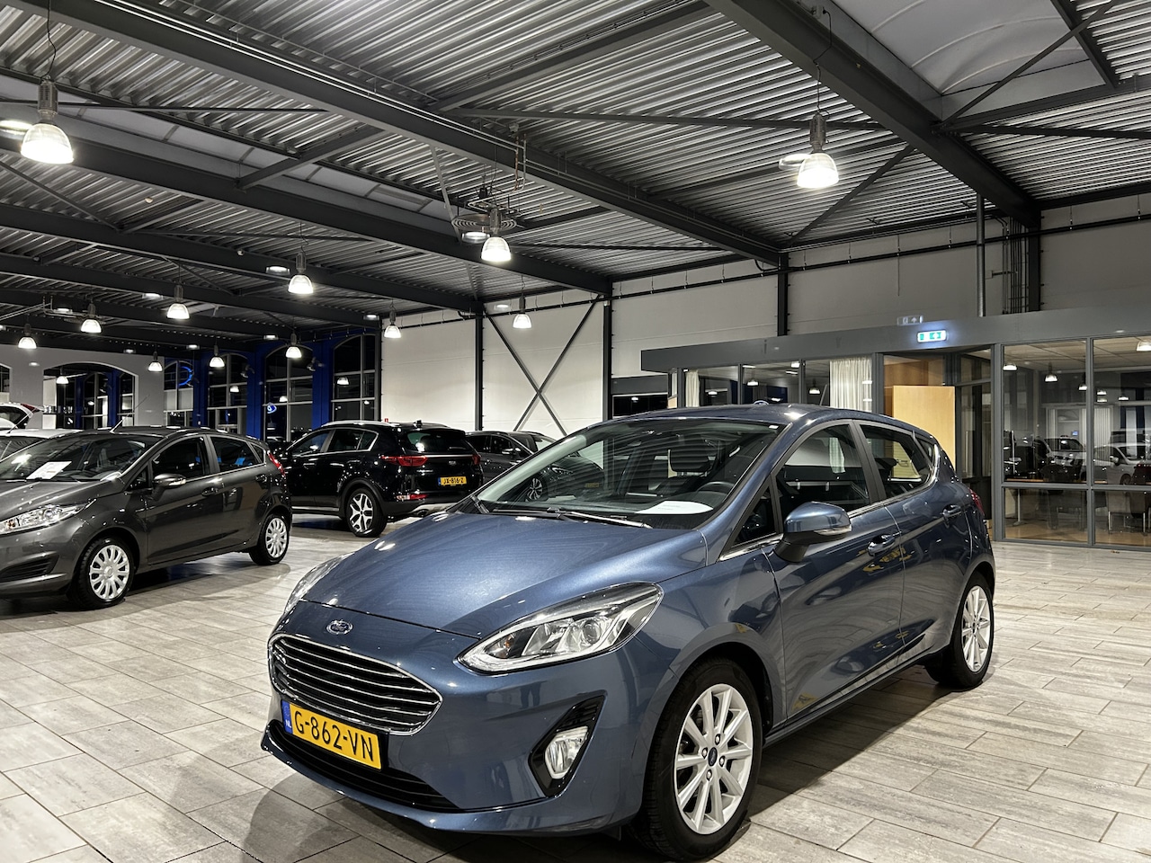 Ford Fiesta - EcoBoost 100 pk Titanium | Trekhaak | LED | Clima | PDC | LMV | Apple Carplay/Android Auto - AutoWereld.nl