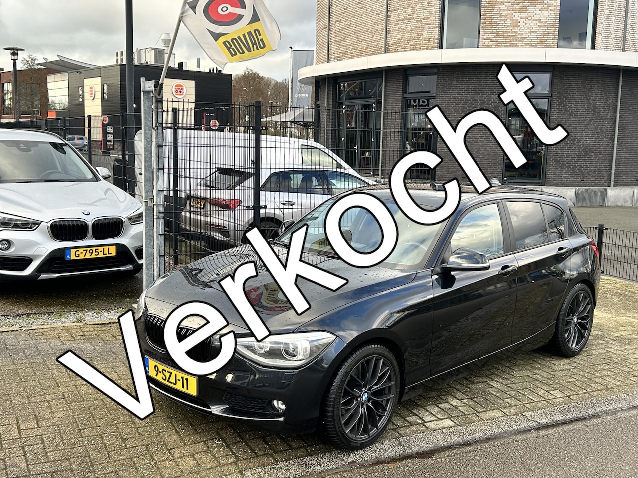 BMW 1-serie - 116i High Executive Xenon..Zwart leder - AutoWereld.nl