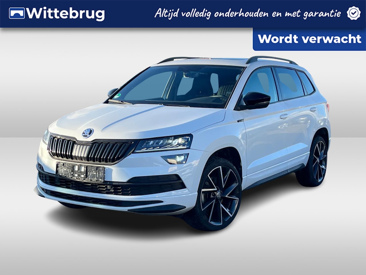 Skoda Karoq - 1.5 TSI ACT Sportline Business / Virtual cockpit / 19 Inch / Panorama dak / Zwenkbare haak - AutoWereld.nl