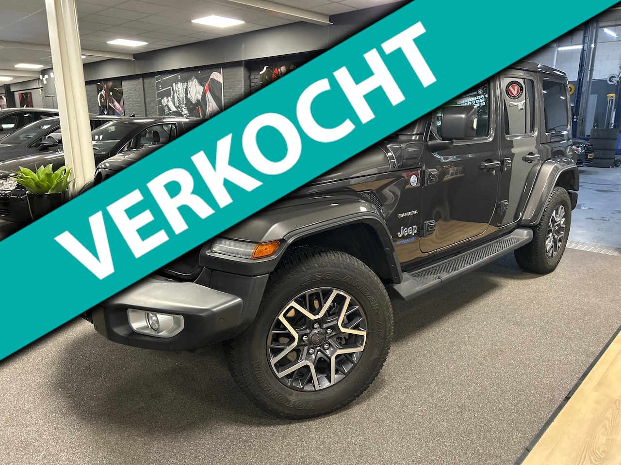 Jeep Wrangler Unlimited - 4xe 380 Sahara 4xe 380 Sahara,cabrio dak,leer,navi,camera,PHEV,alpine audio - AutoWereld.nl