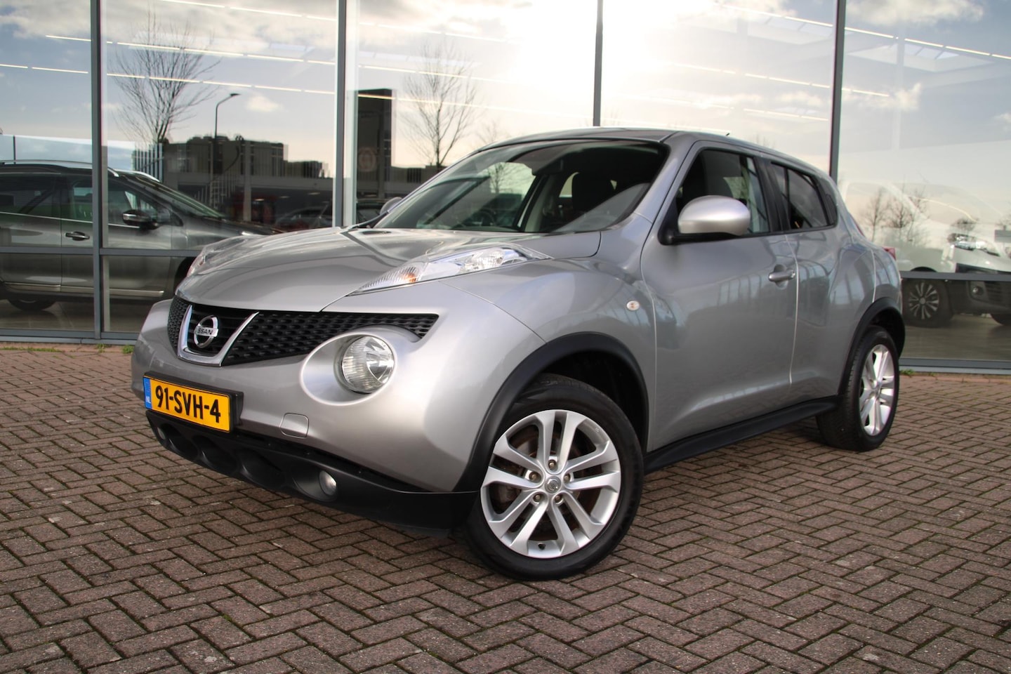 Nissan Juke - 1.6 Tekna Airco/ECC Navi Camera Cruise Trekhaak - AutoWereld.nl