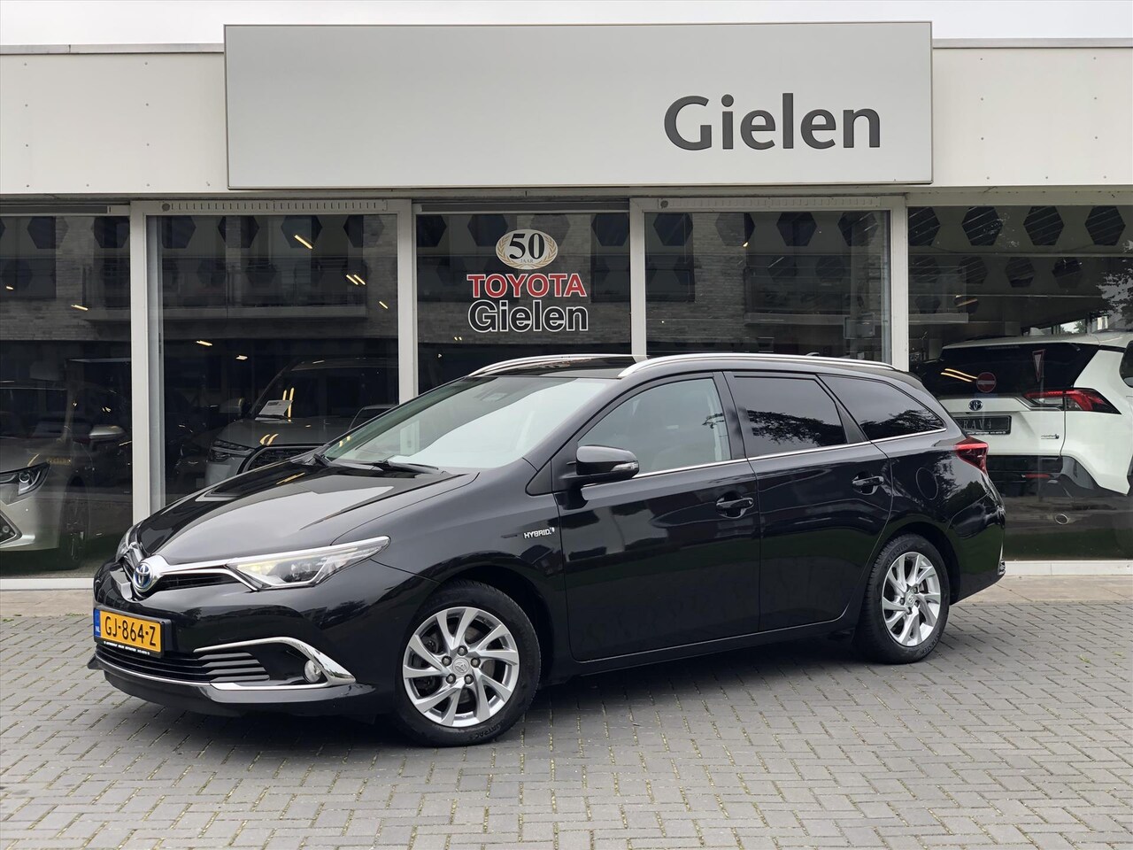 Toyota Auris Touring Sports - 1.8 Hybrid Lease Pro | Panoramadak, Navigatie, Parkeersensoren, Half leer, Stoelverwarming - AutoWereld.nl