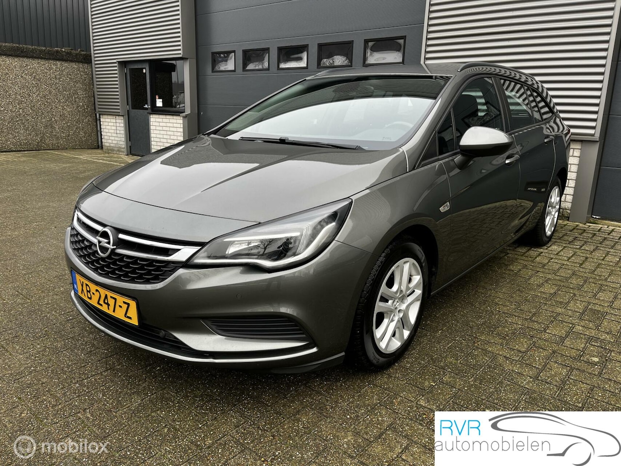 Opel Astra Sports Tourer - 1.0i NAVI / CRUISE / PDC - AutoWereld.nl