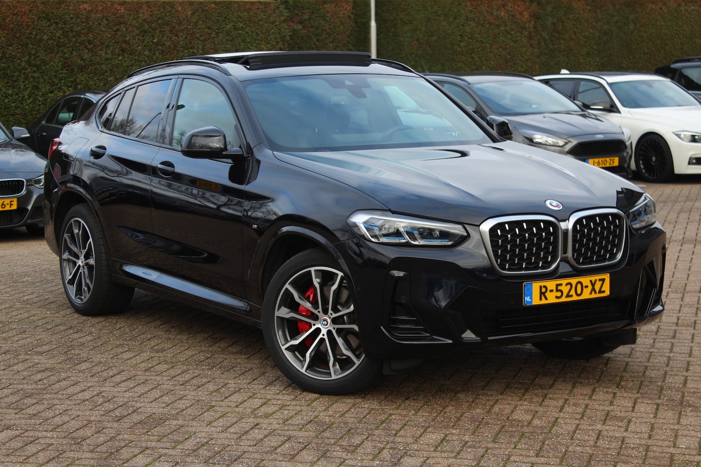 BMW X4 - xDrive20i Business Edition M Sport / Trekhaak / Panoramadak / Camera / Leder / Sfeerverlic - AutoWereld.nl