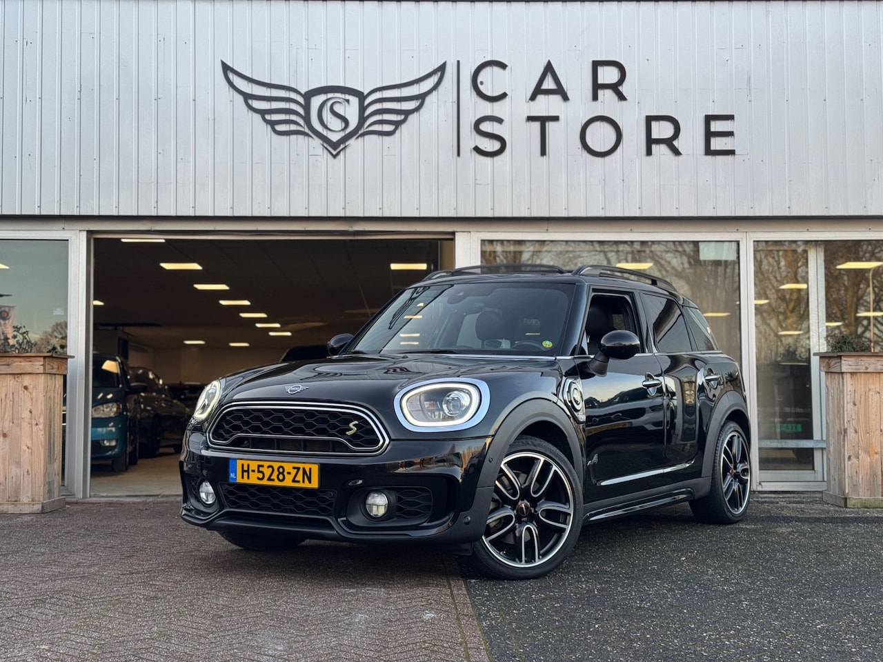 MINI Countryman - Mini 2.0 Cooper S E ALL4 JCW 225PK HYBRID|PANO|HEAD UP|NAV|PDC|LEDER|19"LM VELGEN|FULL OPT - AutoWereld.nl