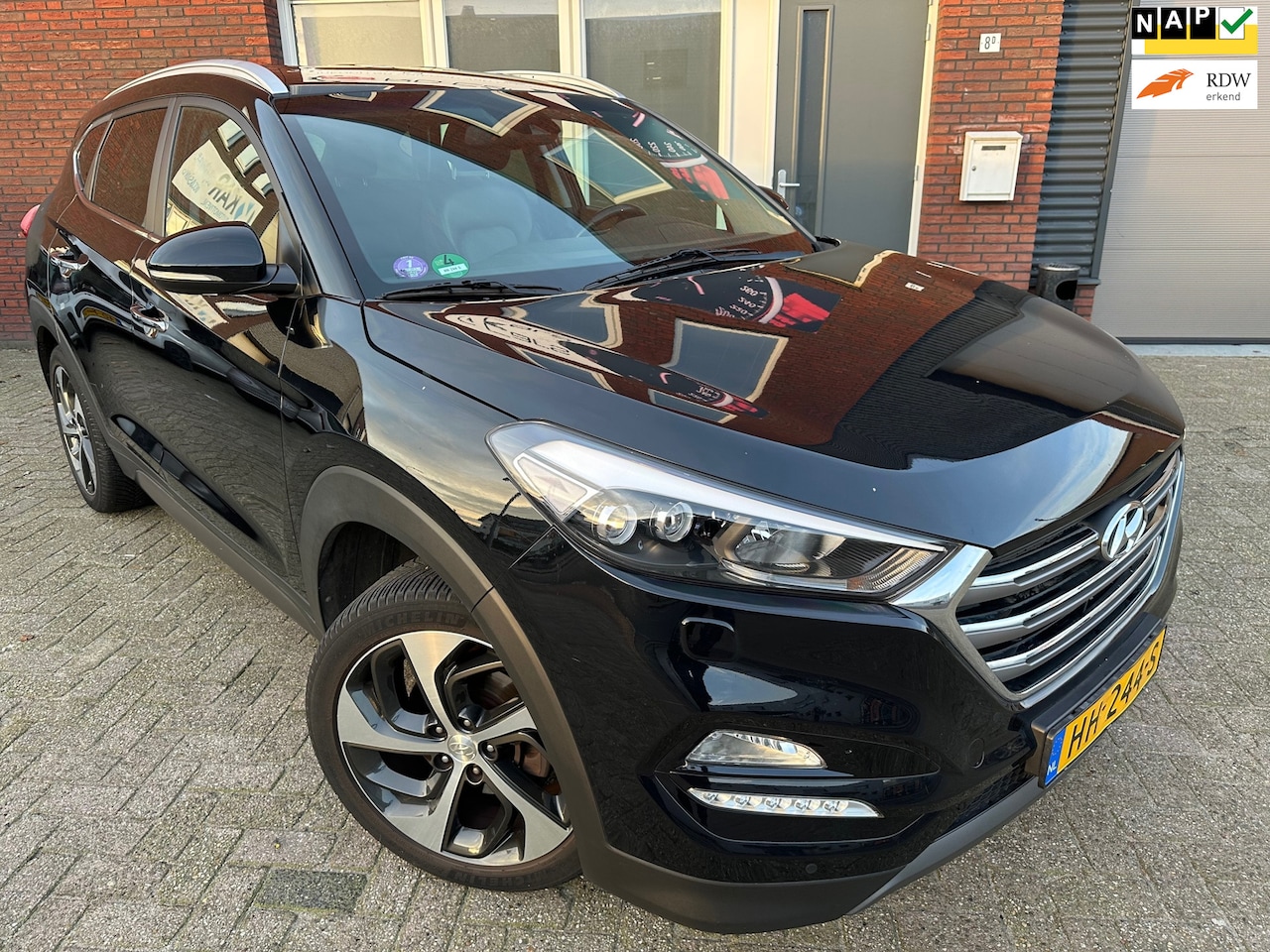 Hyundai Tucson - 1.6 GDi Premium / Leder / Camera / Navi / PDC / Clima - AutoWereld.nl