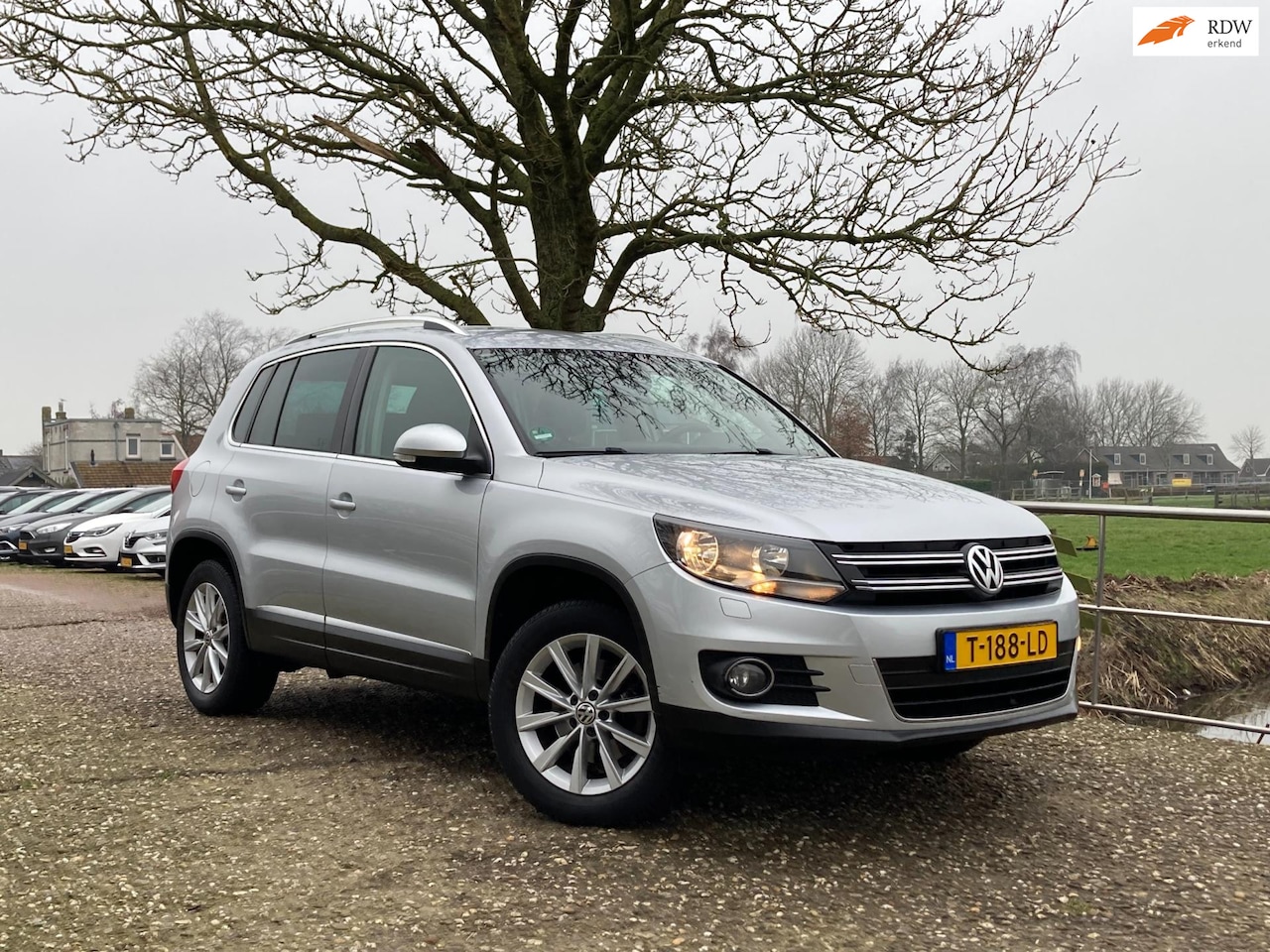 Volkswagen Tiguan - 1.4 TSI Sport&Style | PDC + Clima + Cruise + Navi nu € 9.975,-!!! - AutoWereld.nl