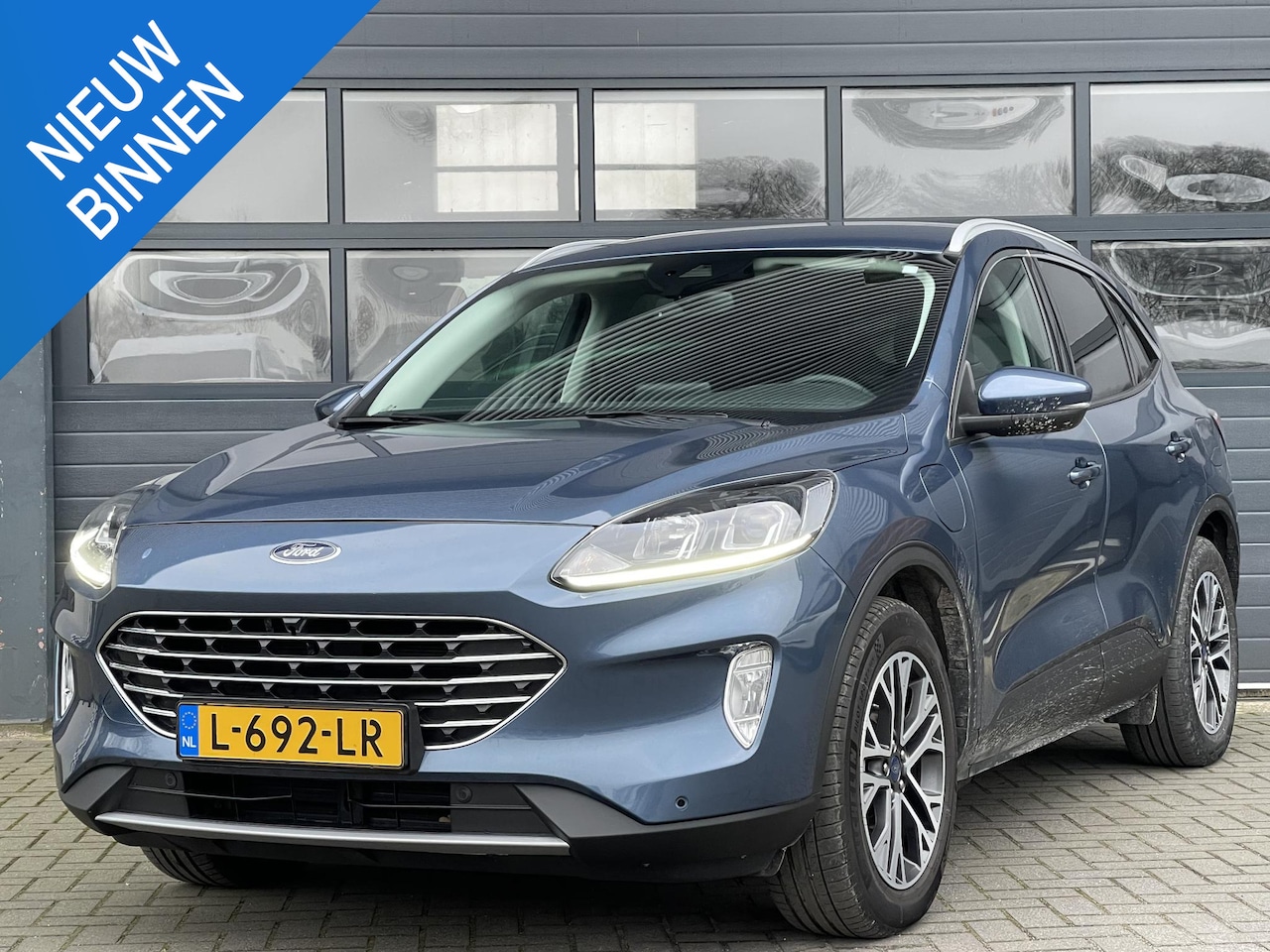 Ford Kuga - 2.5 PHEV TITANIUM I AUTOMAAT I APPLE/ANDROID I ACHTERUITRIJCAMERA I NAVIGATIE - AutoWereld.nl