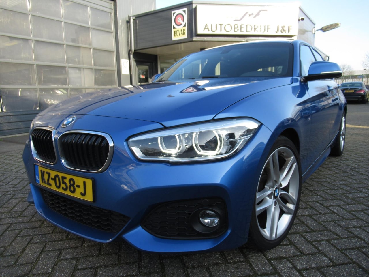 BMW 1-serie - 118i Centennial High Executive / Automaat / NAV / PDC 2x / Dak - AutoWereld.nl