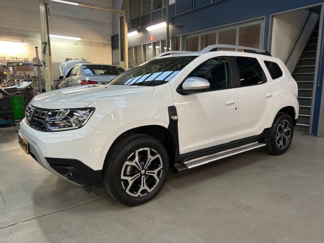 Dacia Duster - 1.0 Tce 100pk 4x2 Prestige | Climate control | Sidebars | Navigatie | Camera | Pdc V+A | L - AutoWereld.nl