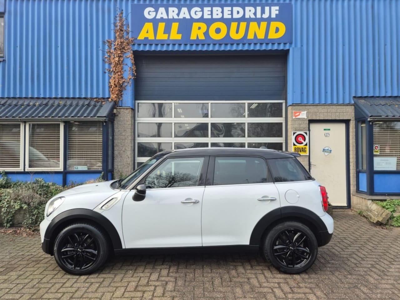 MINI Countryman - 1.6 Cooper Holland Street* cruise control *Navigatie* lichtmetaa - AutoWereld.nl