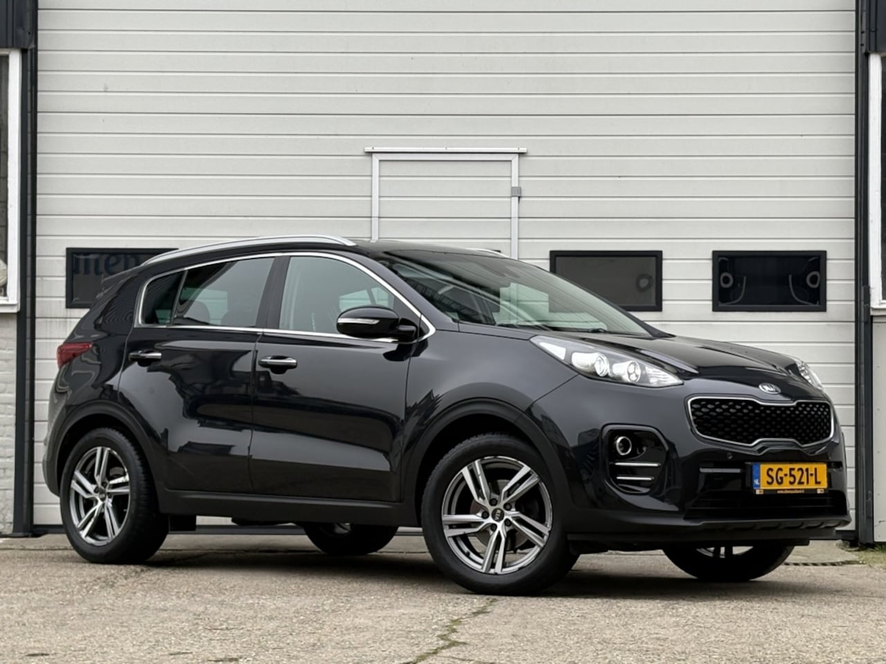 Kia Sportage - 1.6 GDI Design Edition Navi | Leder | Camera | Trekhaak - AutoWereld.nl