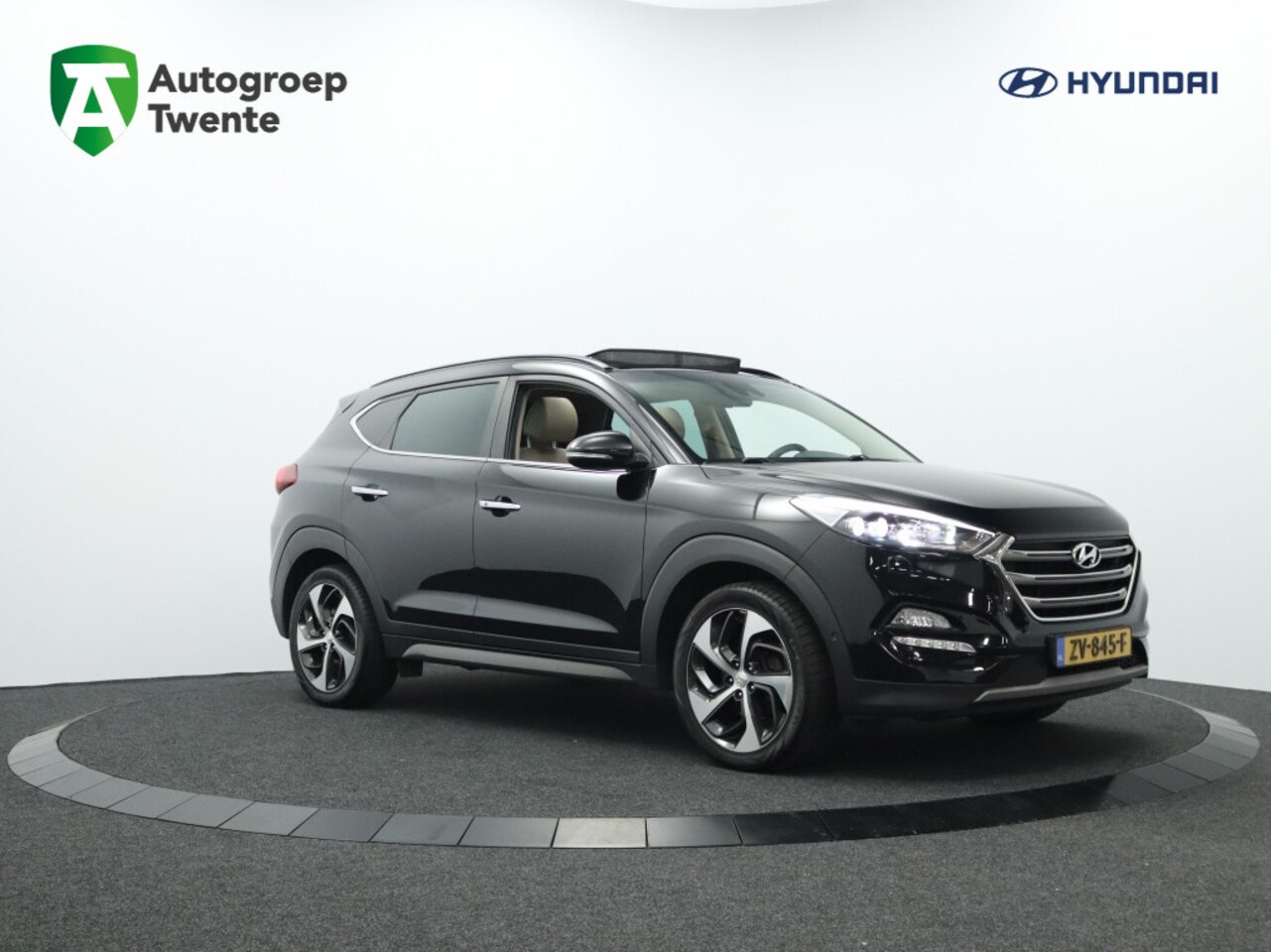 Hyundai Tucson - 1.6 Premium Sky 4WD | Panoramadak | Camera | Navigatie - AutoWereld.nl