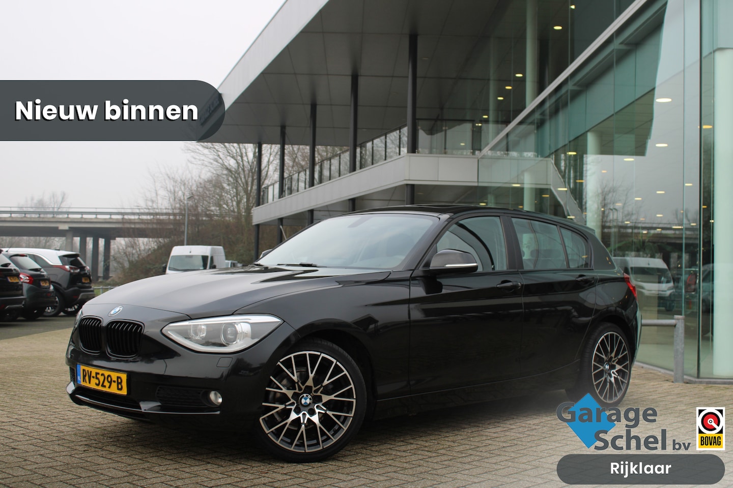 BMW 1-serie - 116i Sport Line - Automaat - Schuifdak - Navi Prof - Rijklaar - AutoWereld.nl