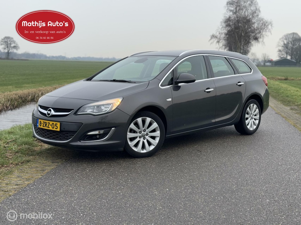 Opel Astra Sports Tourer - 1.4 Turbo Business + Navi PDC 100% onderhouden! - AutoWereld.nl