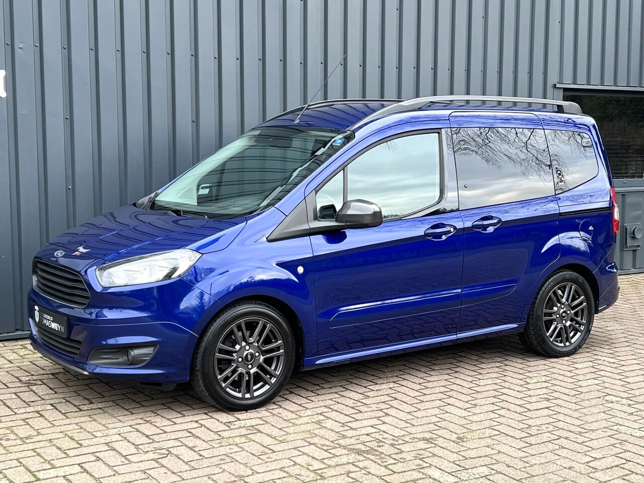 Ford Tourneo Courier - 1.0 Titanium NAVIGATIE!/CLIMA!/ONDERHOUDEN!/ - AutoWereld.nl