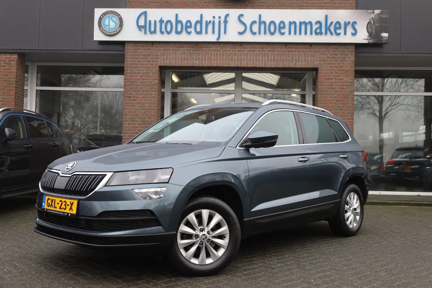 Skoda Karoq - 1.5 TSI ACT Business Edition Plus CAMERA CARPLAY DAB NAVI SFEERVERLICHTING RUIT+STOELVERWA - AutoWereld.nl